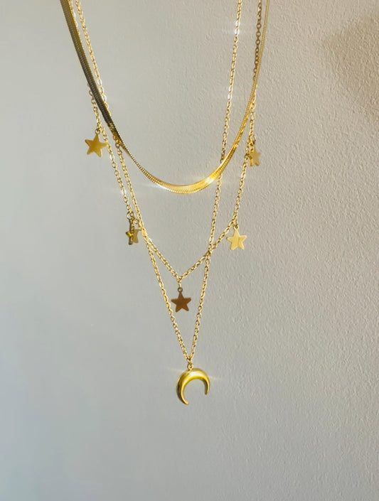 Triple Necklace featuring a snake, stars, and crescent